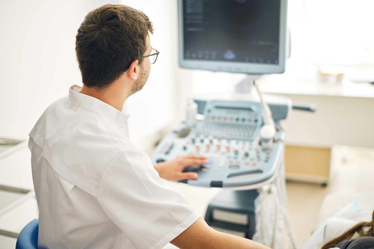 Doctor looking at medical device