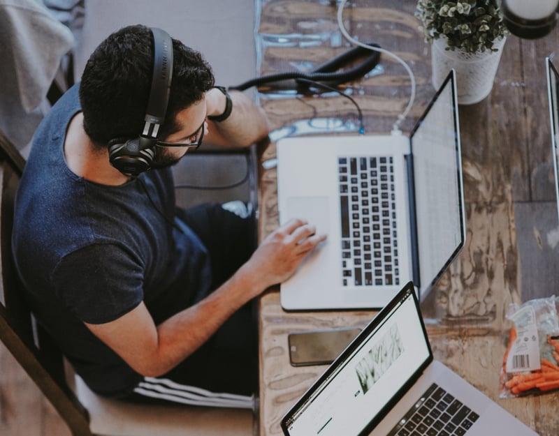 Man working on his laptop seen from above