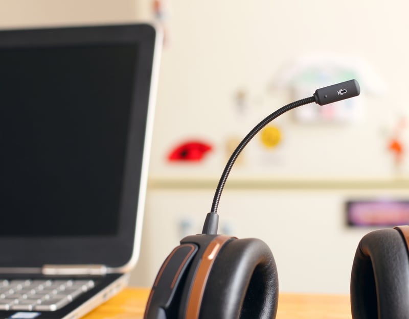 Picture of a head set and a computer