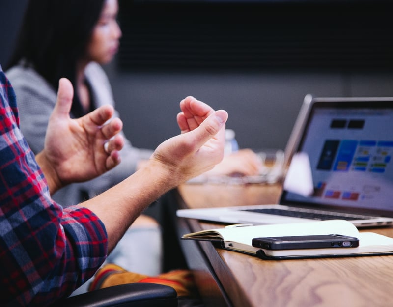 Picture of hands in front of a PC