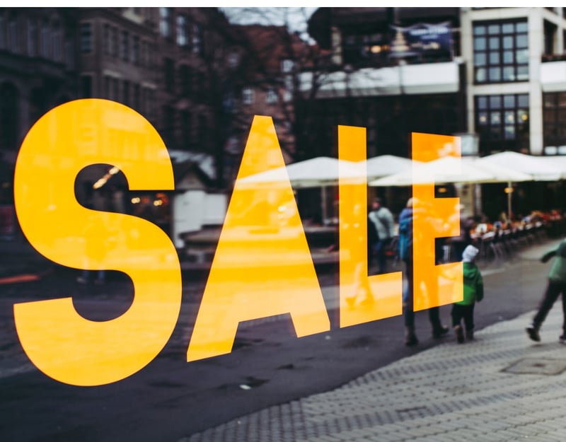 The word Sale written on a shopping window