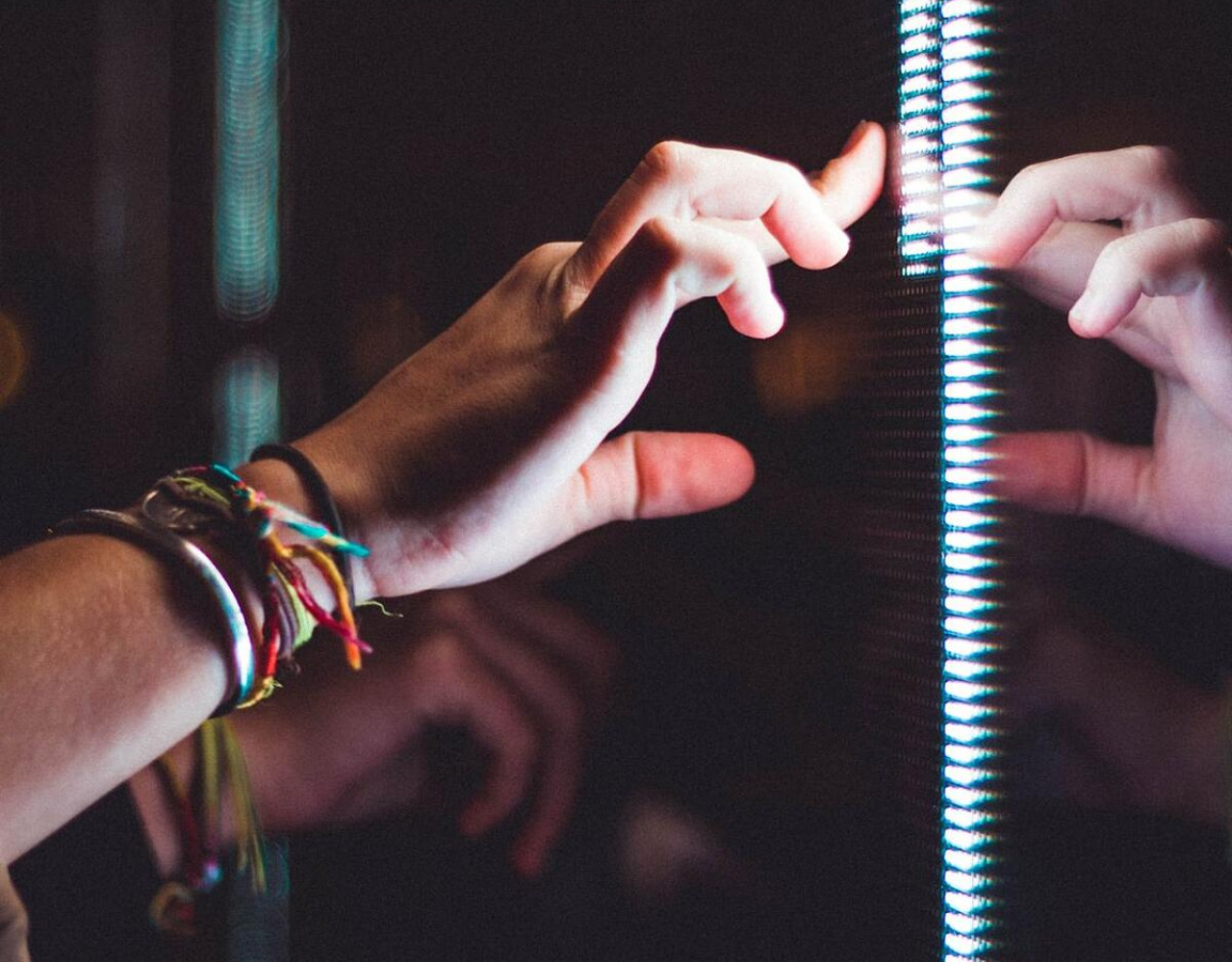 Hand touching a screen