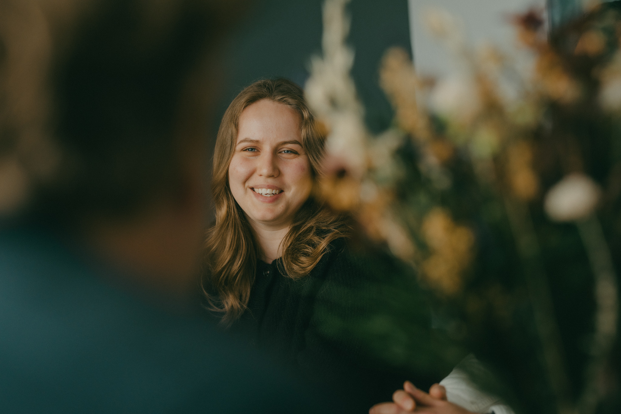 A person behind flowers