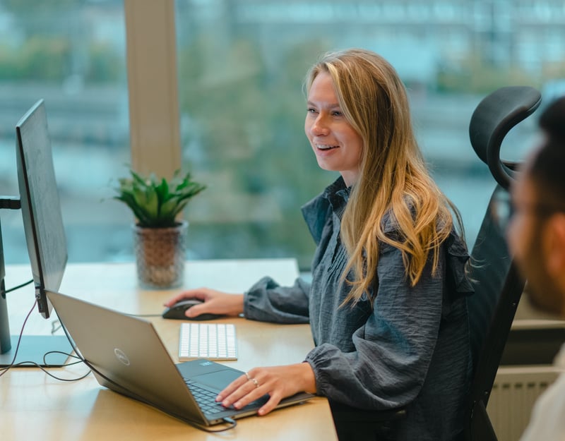 Woman sitting and working on a computer