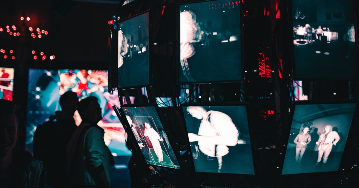 Two people looking at screens